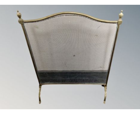 A vintage brass spark guard 