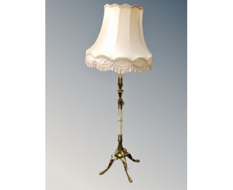 A gilt metal and onyx standard lamp with tasseled shade (af)