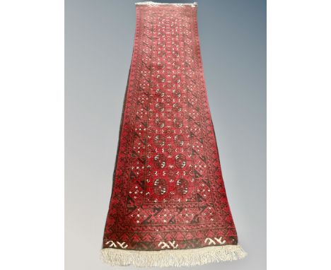 A Bokhara runner, Afghanistan, 290cm by 75cm 