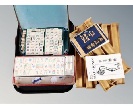 Two Mahjong sets in box and case, eight wooden counter stands 