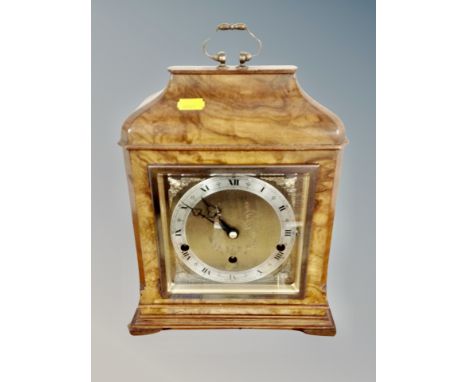 A walnut cased eight day lever Westminster and Whittington chime mantel clock with key, retailed by Elliott of London, height