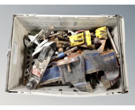 A box of assorted hand tools, woodworking planes, heavy duty bench vice 