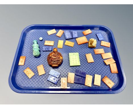A Chinese carved jade seal, two scent bottles and a quantity of pendants