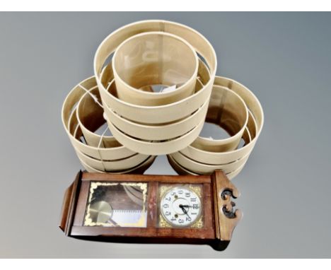 A Lincoln 31 day wall clock together with three contemporary lamp shades 