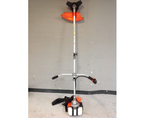 A Pro Gen tools petrol strimmer with harness 