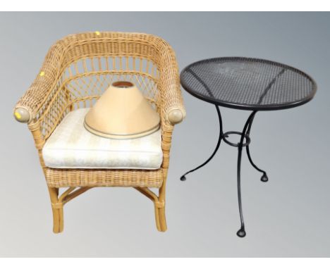 A bamboo and wicker conservatory armchair together with a metal bistro style table and two lamp shades 