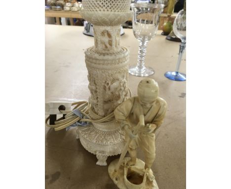 A Japanese figure in the form of a elder and a night light.