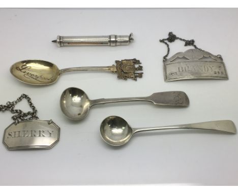 A collection of six silver items including a Georgian wine label, pencil, spoons etc.