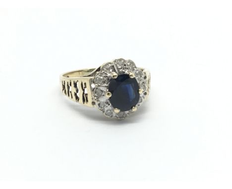 A 9carat gold deep blue sapphire and diamond ring ring size O.