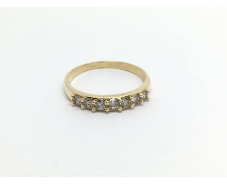 An 18carat gold ring set with a row of diamonds. ring size O-P