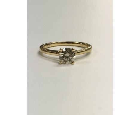 An 18ct yellow gold solitare diamond ring approx 0.75ct.