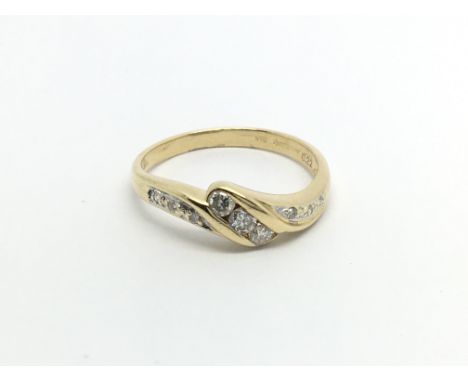 An 18carat gold ring set with brilliant cut diamonds ring size O.