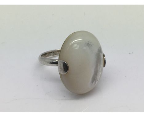 A silver and mother of pearl ring, approx size S.