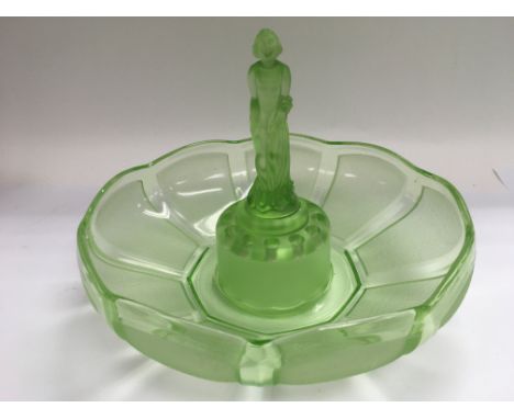An Art Deco style green glass centrepiece with female figure to the centre.