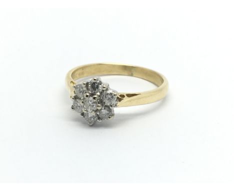 An 18carat gold ring set with a pattern of brilliant cut diamonds approximately 0.50 of a carat ring size N.