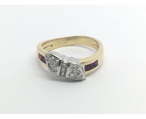 An 18carat gold ring set with a pattern of diamonds and ruby  ring size O