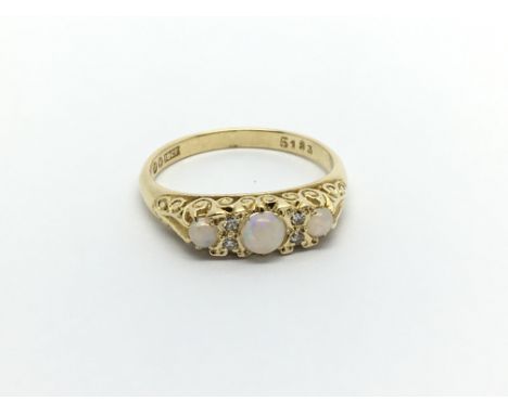 A 1950s 18carat gold ring set with Opals ring size N-O