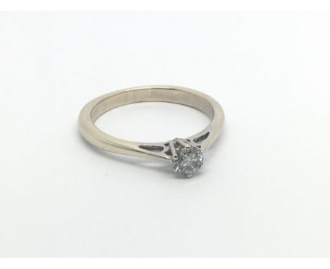 An 18carat gold ring set with a brilliant cut solitaire diamond 0.23 of a carat ring size O-P