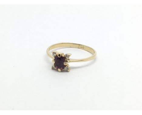 A 9carat gold ring set with a small ruby with a diamond to each corner ring size C-H