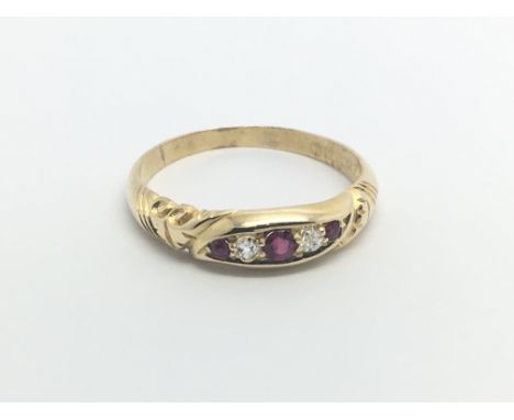 An 18carat gold ring set with a row of ruby and diamonds ring size T-U