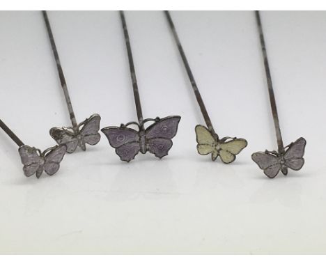 Five antique silver and enamel butterfly hatpins.