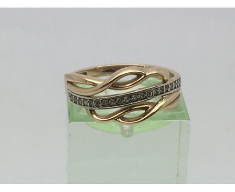 A gold ring set with a row of diamond chips, approx 2.5g and approx size M.