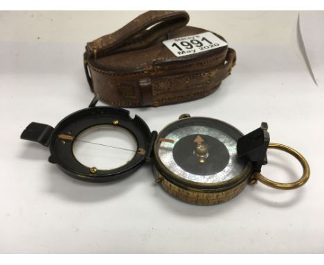 A WW1 brass military MK II Verner compass with mother of pearl and painted face, and leather case.