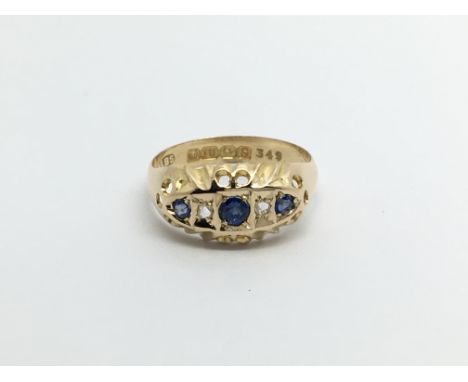 A 1920s 18carat gold ring set with three sapphire and diamonds ring sizeK-L