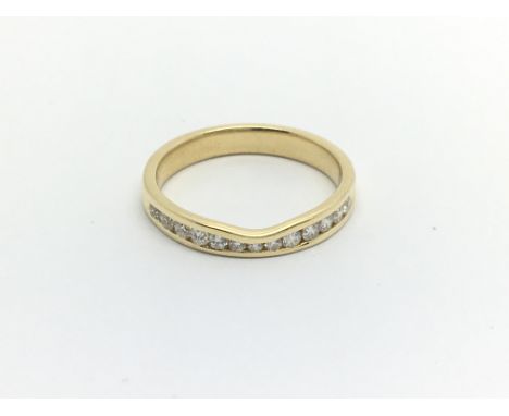 An 18carat gold ring set with a row of brilliant cut diamonds 0.33 of a carat ring size N-O