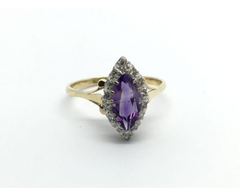 An 18carat Amethyst ring set with diamonds and a good sized central sapphire ring size N.