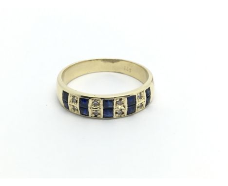 A 14carat gold ring set with alternating sapphire and diamonds ring size Q.