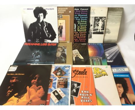 A collection of LPs by various artists including The Beatles, Jimi Hendrix, Ike &amp; Tina Turner, Genesis and others.