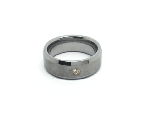 A Titanium wedding band set with a solitaire diamond ring size R.