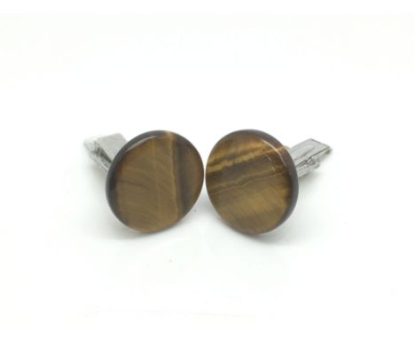 A pair of sterling silver and tiger's eye quartz cufflinks.