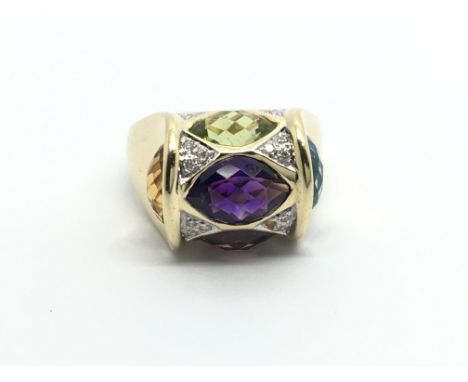 An unusual ring set with multi coloured stones and diamonds ring size M