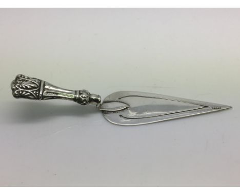 A silver bookmark in the form of a trowel, approx length 9cm, assay indistinct.