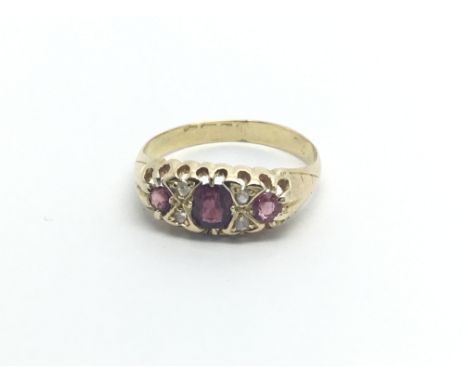 A Vintage gold ring set with three ruby and small diamonds ring size M-N