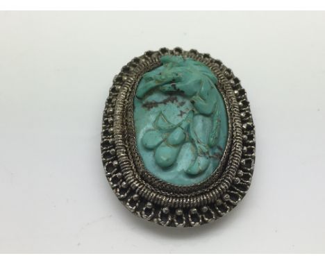 A vintage Chinese silver and turquoise clip brooch.