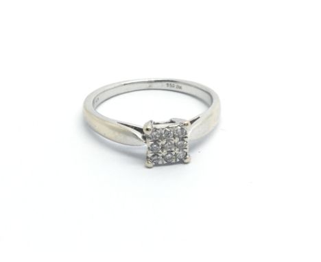 An 18carat  gold ring set with a a square pattern of diamonds ring size M-N.