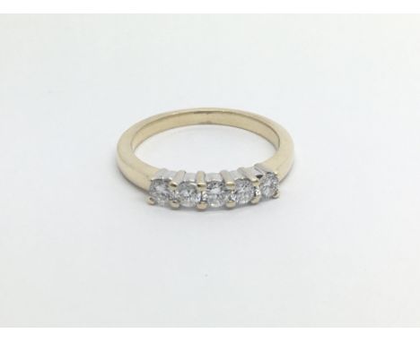 A 14carat gold ring set with a row of five brilliant cut diamonds Approximately 0.75 of carat ring size N-O