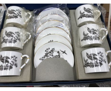 A boxed Royal Worcester coffee set and 4 porcelain figures.