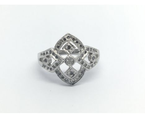 An Art Deco style ring of open geometric design set with diamonds ring size M-N