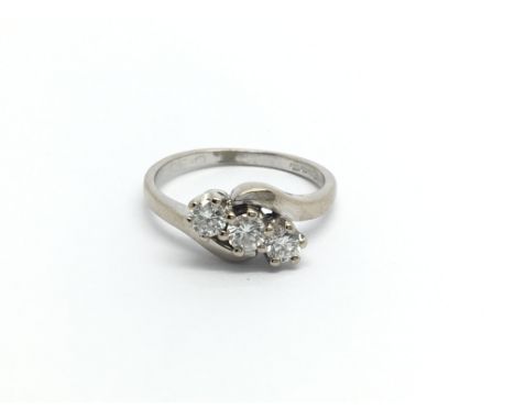 An 18carat white gold ring set with three brilliant cut diamonds approximately 0.50 of a carat total. ring size L-M