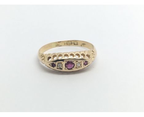 An 18carat gold ring set with ruby and diamonds ring size I.