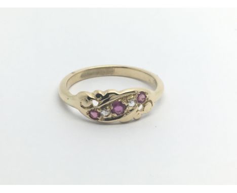 A Vintage 18carat gold ring set with three ruby and diamonds ring size P.