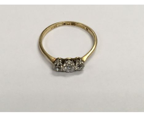 A 18 ct gold ring inset with 3 diamonds size p .