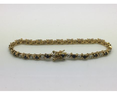 A silver gilt and natural sapphire bracelet.