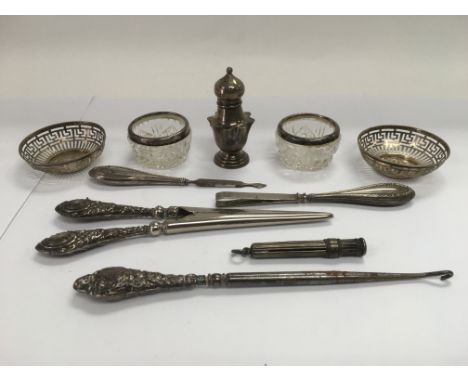 A bag of silver items including a pair of small dishes, glove stretchers etc.