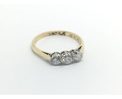 An 18carat gold ring set with three brilliant cut diamonds 0.33 of a carat.ring size N-O