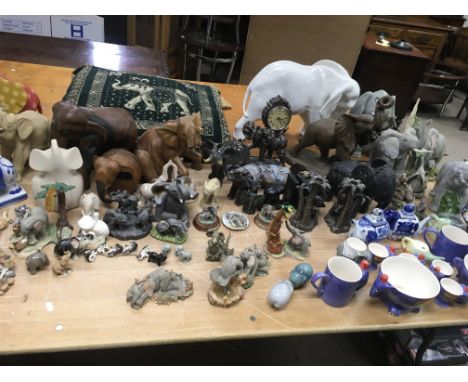 boxes containing a collection of Elephants , x13 boxes, including Tuskers, wooden and ceramic, picture only shows part of lot